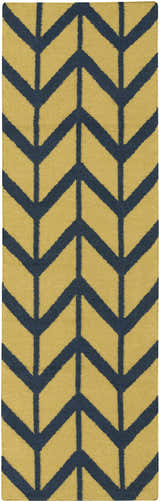 Close-up of the Eland Area Carpet. Hand-woven wool rug with a dark blue chevron pattern on an olive background. Design-Runner-268