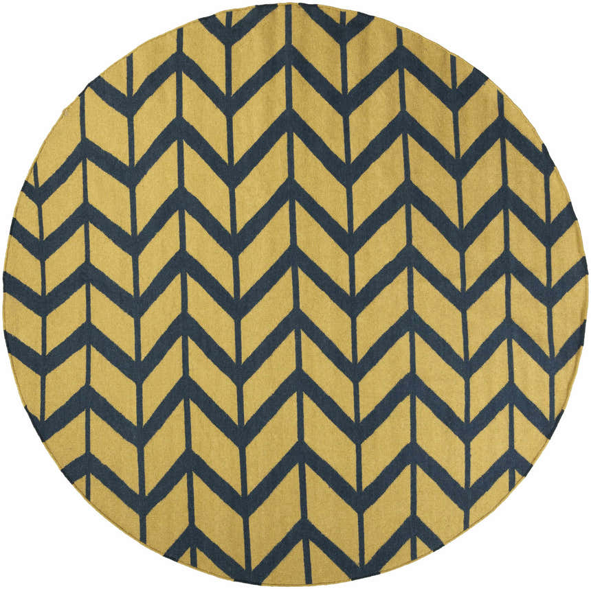 Close-up of round Eland Area Carpet. Dark blue chevron pattern on olive 100% wool rug. Hand woven texture. Design-Round