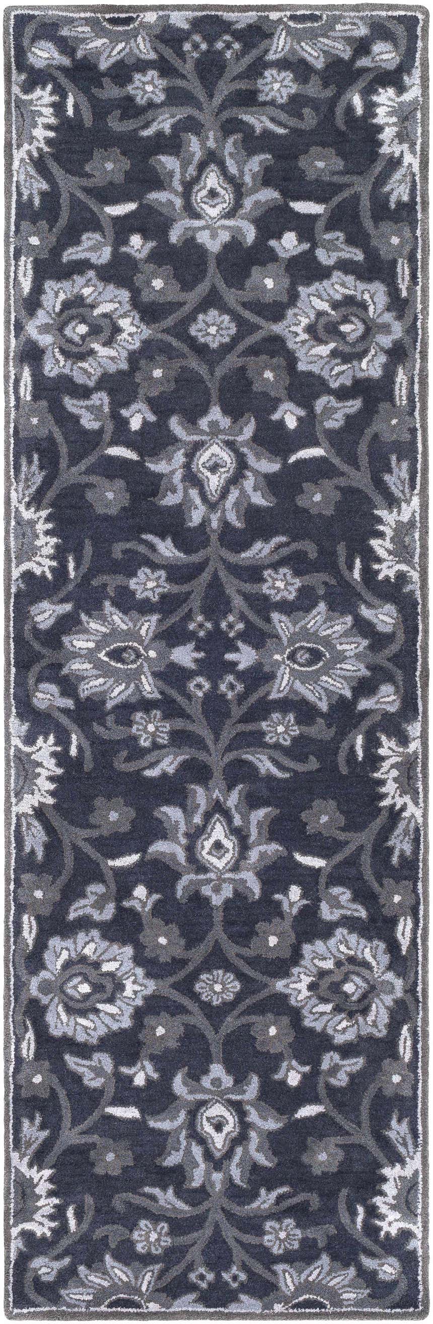Close-up of the Conesus Hand Tufted Blue Area Rug. Wool rug with a traditional floral pattern in charcoal, denim, and slate blue. Design-Runner-268