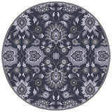 Close-up of the round Conesus Hand Tufted Blue 1191 Area Rug. Features a traditional floral pattern in charcoal, slate, and ink blue. Design-Round-6
