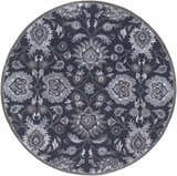 Close-up of the round Conesus Hand Tufted Blue rug. Features a traditional floral pattern in charcoal, denim, and slate blue wool. Design-Round-8