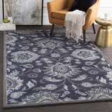 Living room scene with a Conesus Hand Tufted Blue 1191 Area Rug, mustard chair, and gold side table. Floral, traditional rug. Roomscene-Rectangle
