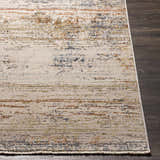 Close-up of Eltingville Area Rug showing brick red, burnt orange, cream, and blue abstract pattern and polyester texture. Front