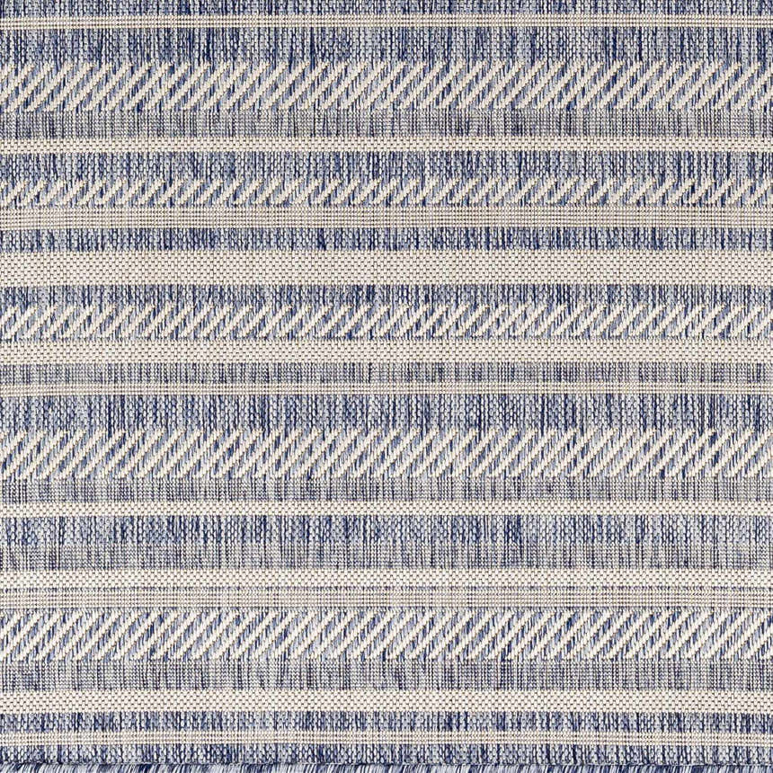 Close-up of the Emirgazi Striped Nordic Rug. Blue and oatmeal stripes with a subtle geometric pattern. Machine woven texture. Swatch