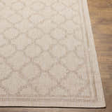 Close-up of the Noam Beige Indoor & Outdoor Rug showing its bone color and traditional geometric pattern. Front