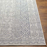 Close-up of Epson Indoor Outdoor Rug in blue, gray, and off-white with a geometric, bohemian-inspired design. Front