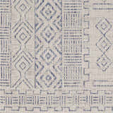 Close-up of Epson Indoor & Outdoor Rug. Bohemian style rug with blue geometric pattern on oatmeal background. Swatch