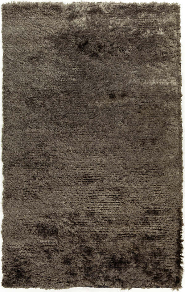 Close-up of the medium gray Erial Area Carpet, a hand woven shag rug with a soft, textured pile. Design-Rectangle-58