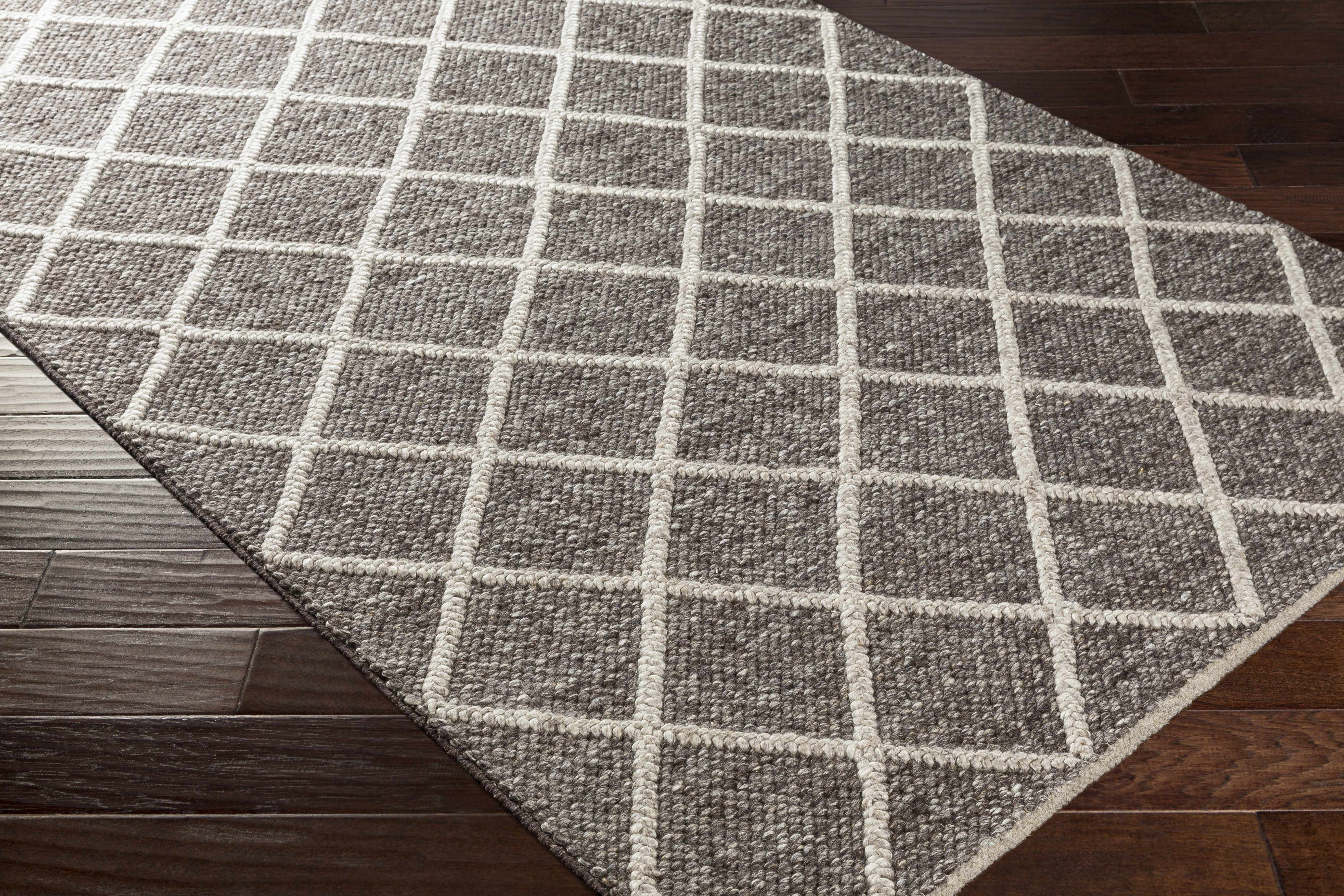 Zoomed-in view of the edge of Syosset 2x3 Brown Trellis Wool&Viscose Rug - Clearance, focusing on border details and craftsmanship. Contemporary Area Rug Backing  