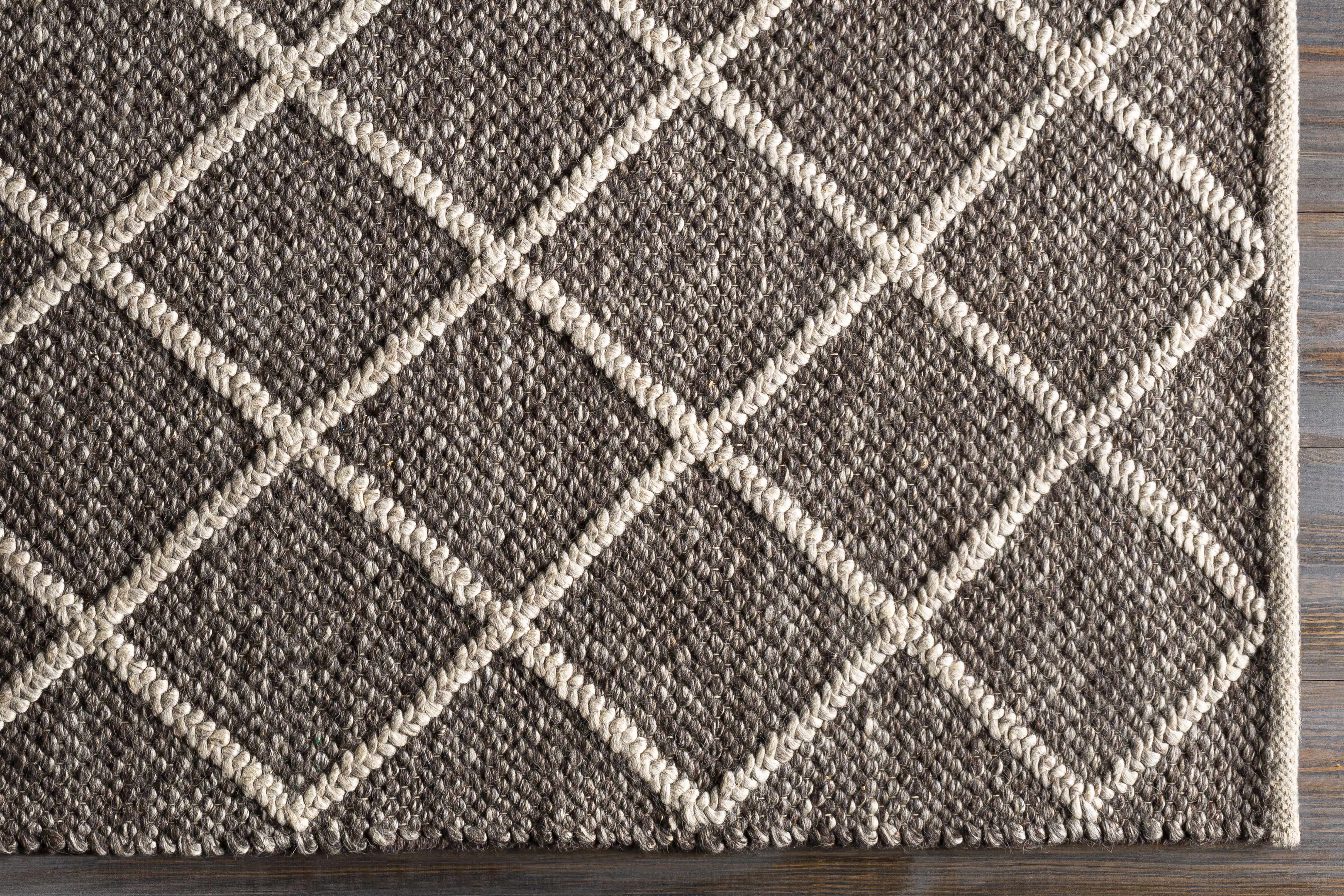 Reverse side of Syosset 2x3 Brown Trellis Wool&Viscose Rug - Clearance, focusing on underside structure and material.Contemporary Area Rug Backing  