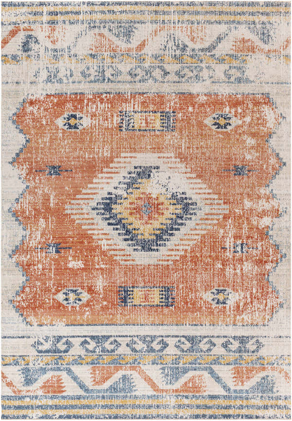 Close-up of the Etobicoke Area Rug featuring a Southwestern-inspired design in brick red, cream, denim, and gray. Distressed texture. Design-Rectangle-537