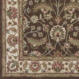 Close-up of the Eupora Wool Rug. Brown rug with a traditional floral pattern in red, olive, and cream. Hand-tufted texture. Swatch