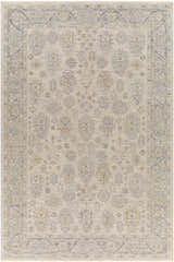 Close-up of the Coby Sage Avant Garde rug. Features traditional patterns in brown, charcoal, sage, and teal on a light background. Design-Rectangle-6796