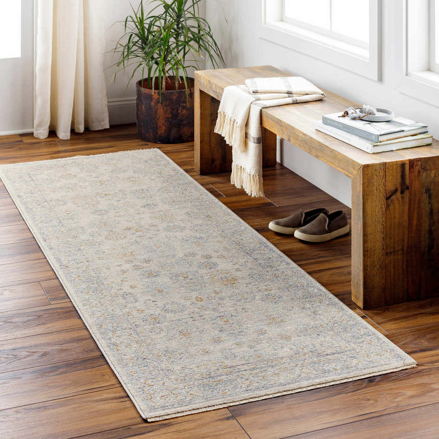 Entryway with wood floors and Coby Sage Avant Garde rug, bench with blanket, potted plant, and natural light. Roomscene-Runner