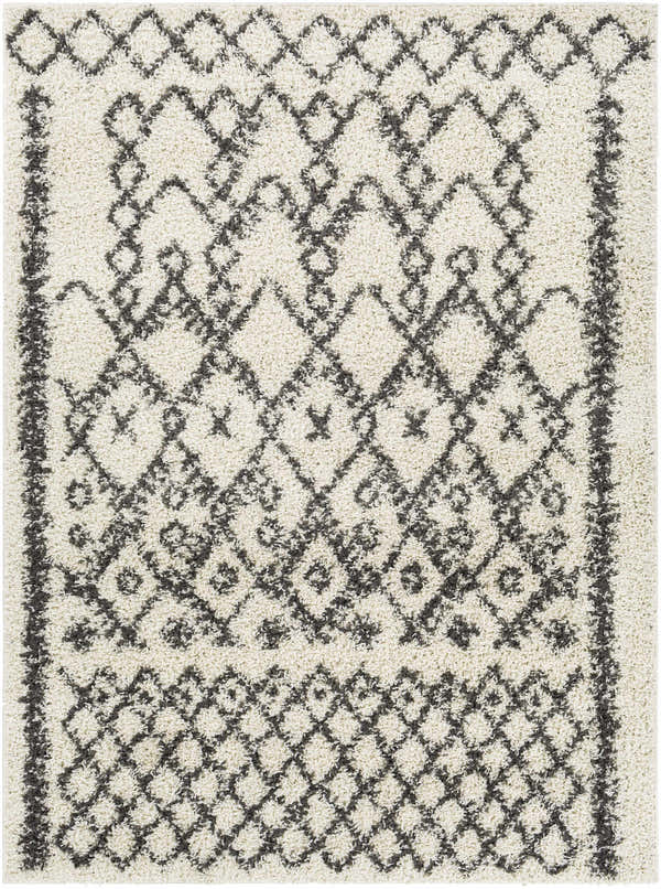 Close-up of the Fenstanton Area Rug, a cream shag rug with a charcoal geometric diamond pattern. Design-Rectangle-527