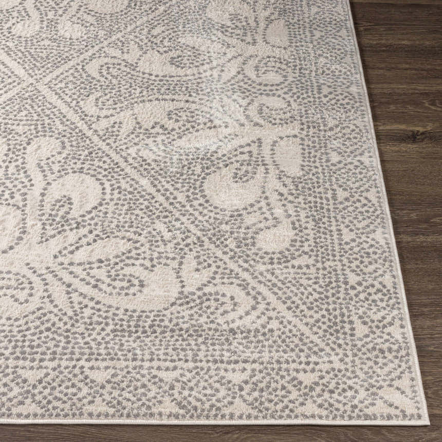Close-up of the Fernwood Area Rug showing its gray dotted pattern and soft texture on dark wood floor. Front
