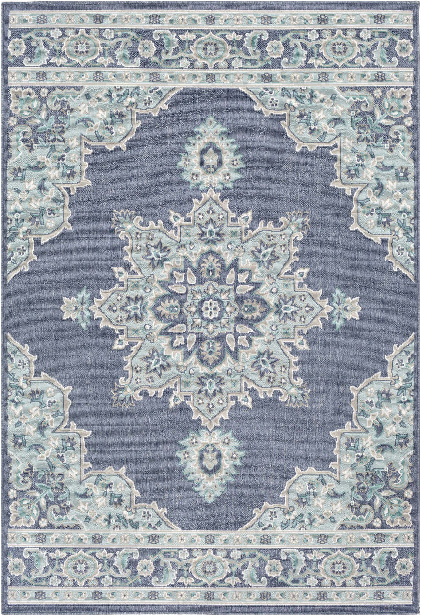 Close-up of the Ferron Area Rug. Navy olefin rug with pale blue, taupe, teal, and white traditional floral pattern. Design-Rectangle-537