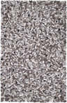 Close-up of the hand woven Fillmore Area Carpet. Black, charcoal, cream, and gray wool pebbles create a contemporary design. Design-Rectangle-58