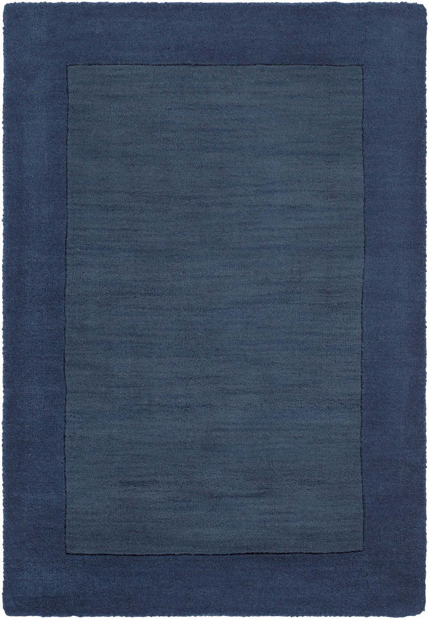 Close-up of a Bordered Solid Ink Blue Wool Rug showing the textured wool and color variations. Design-Rectangle-23