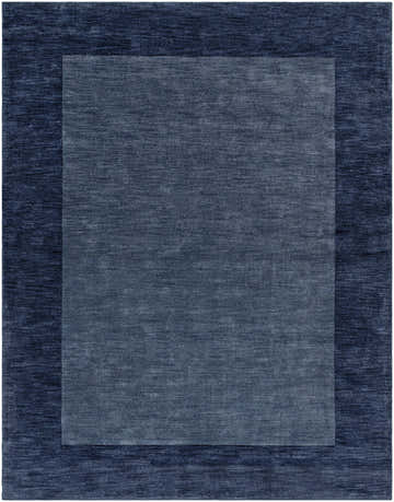Close-up of the Bordered Solid Ink Blue Wool Rug, showcasing the textured wool and the two-tone ink blue border design. Design-Rectangle-7696