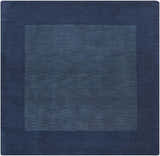 Close-up of the Bordered Solid Ink Blue Wool Rug, showing its subtle texture and two-tone ink blue color. Design-Square-8