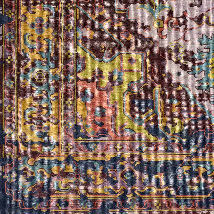 Close-up of the hand-knotted Flagtown Area Rug. Traditional design with blue, burgundy, coral, and olive colors. 100% wool texture. Swatch