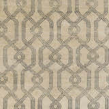 Close-up of the Fairborn Wool Rug. Charcoal and taupe geometric pattern on a hand-knotted wool rug. Swatch