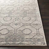 Close up of the Frenchtown Area Rug showing a geometric pattern in beige and gray. Front