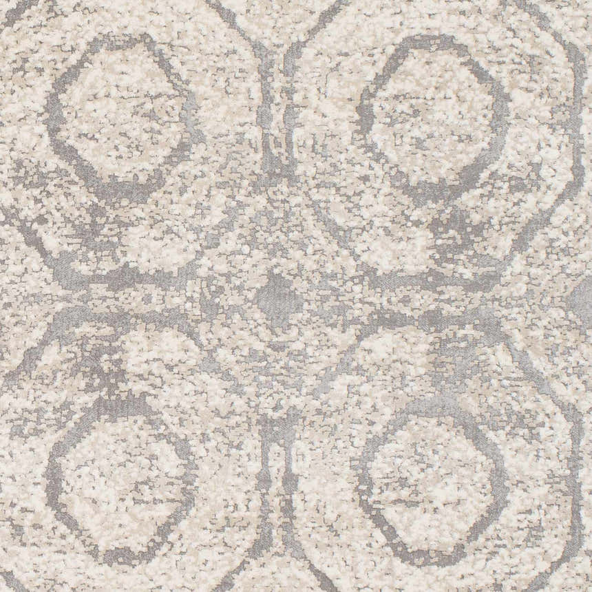 Close-up of the Frenchtown Area Rug showing a geometric pattern in neutral shades of gray and beige. Soft texture. Swatch