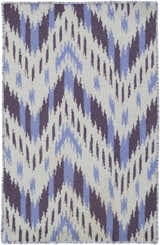 Close-up of Fryeburg Area Rug. Hand woven wool rug with beige ground and lavender, purple ikat pattern. Design-Rectangle-23