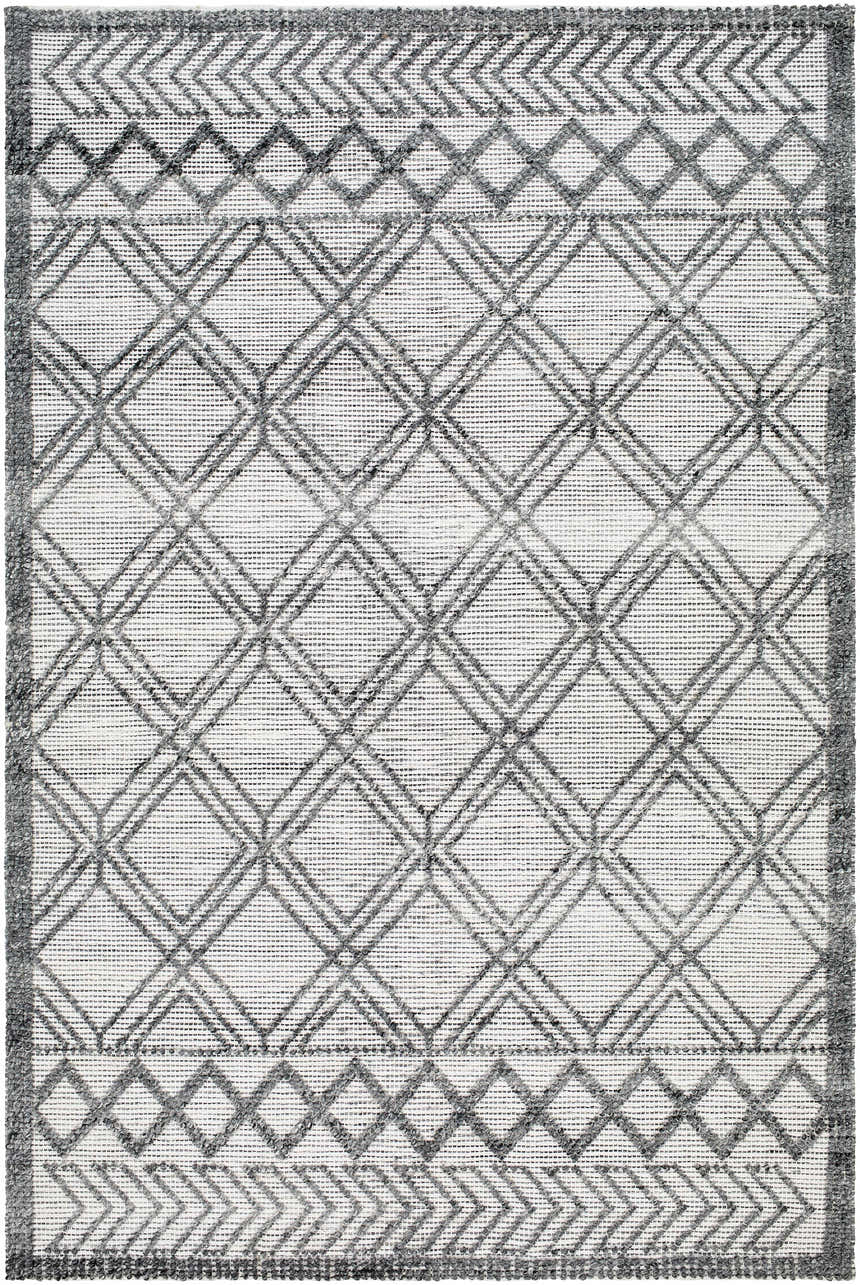 Close-up of the Gada Area Rug. Hand-woven rug with a geometric diamond pattern in dark gray and light gray. Design-Rectangle-576
