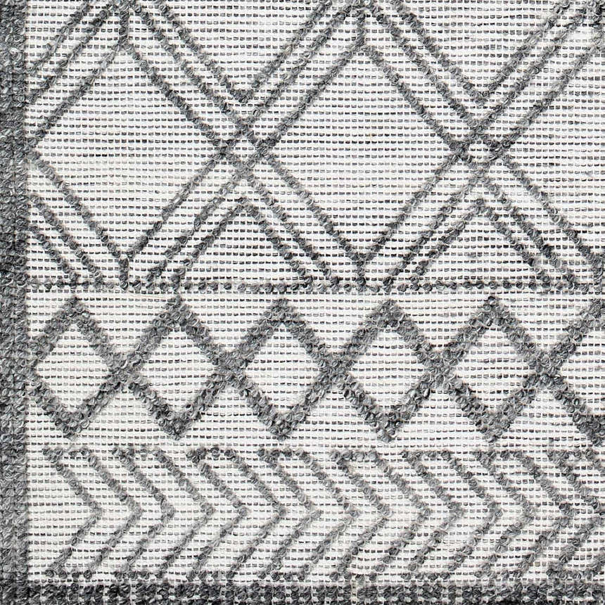 Close-up of the Gada Area Rug, a hand-woven rug with a gray and light gray geometric diamond pattern. Swatch
