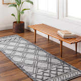 Entryway with Gada Area Rug runner in gray and brown, wood bench, and plant. Farmhouse style. Roomscene-Runner