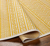 Close-up of the Galal Area Rug in beige and yellow. Farmhouse style rug with geometric pattern and machine woven texture. Fold
