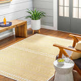 Bright sunroom with a yellow and white geometric Galal Area Rug, wood floors, and casual seating. Roomscene-Rectangle