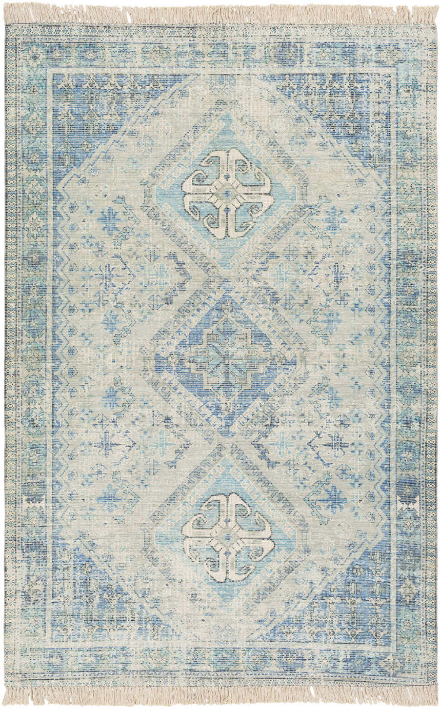Close-up of Galgate Area Rug. Hand-woven cotton rug in aqua, teal, and sage with a traditional diamond pattern and fringe. Design-Rectangle-576