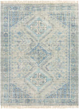 Close-up of Galgate Area Rug. Hand-woven cotton rug in aqua, teal, and sage with traditional diamond and geometric patterns. Design-Rectangle-810