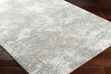 Close-up of the Ganit Thick Luxe Boutique Rug. Beige, bone, and gray abstract pattern. Modern design. Corner