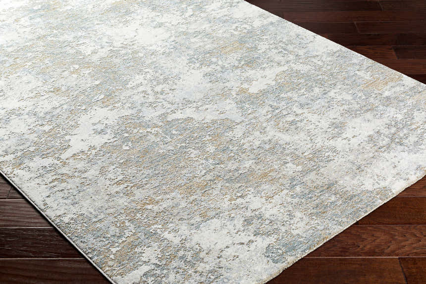 Close-up of the Ganit Thick Luxe Boutique Rug. Beige, bone, and gray abstract pattern. Modern design. Corner