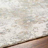 Close-up of the Ganit Thick Luxe Boutique Rug. Beige, bone, and gray abstract pattern. Luxe texture. Texture