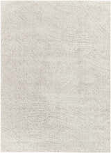 Close-up of the Eaglehawk Luxe Rug. Features a textured, contemporary design in charcoal, cream, light beige, and light gray. Design-Rectangle-5373