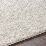 Close-up of the Eaglehawk Luxe Rug showing its plush texture and subtle charcoal and cream color variations. Texture