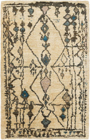 Close-up of the Glide Premium Jute Rug. Hand-knotted rug with a beige backdrop and aqua, blue, and tan geometric patterns. Design-Rectangle-69