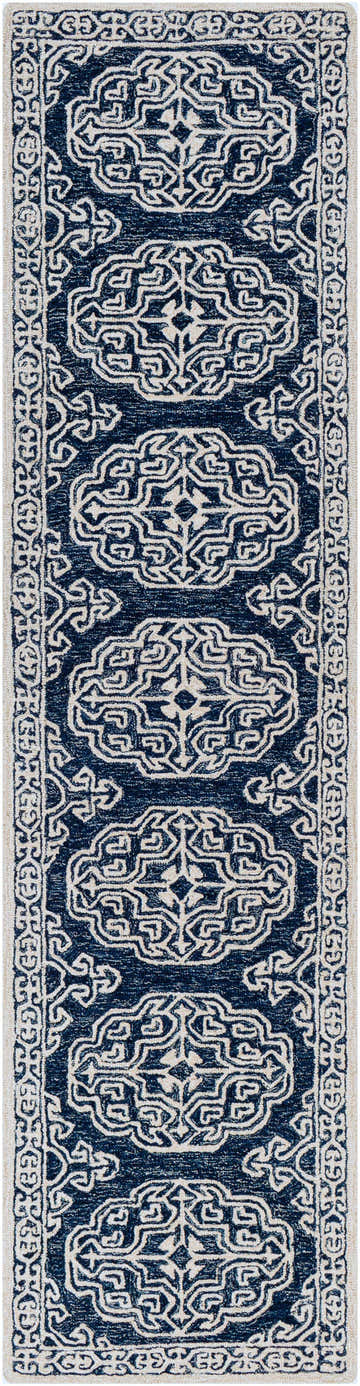 Close-up of the Glenoma Blue Regency Wool Rug showcasing its beige and navy bohemian-inspired pattern. Design-Runner-2710