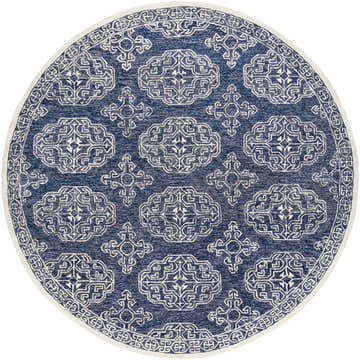 Close-up of the round Glenoma Blue Regency Wool Rug. Features a navy and beige bohemian-style pattern and hand-tufted texture. Design-Round-8