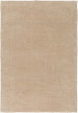 Close-up of a solid, hand-loomed Galata Area Rug in a soft beige. Viscose and wool blend shows subtle texture. Design-Rectangle-23