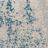 Close-up of Sweeny Beige/Blue Abstract Area Rug. Features teal, slate, and ivory hues in a contemporary pattern. Swatch