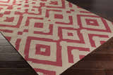 Close-up of the Goldsboro Area Carpet, a hand-woven wool rug in burgundy and taupe with a contemporary geometric pattern. Corner