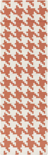 Close-up of the hand woven Goldthwaite Area Rug. Burnt orange and light beige houndstooth pattern. 100% wool texture. Design-Runner-268