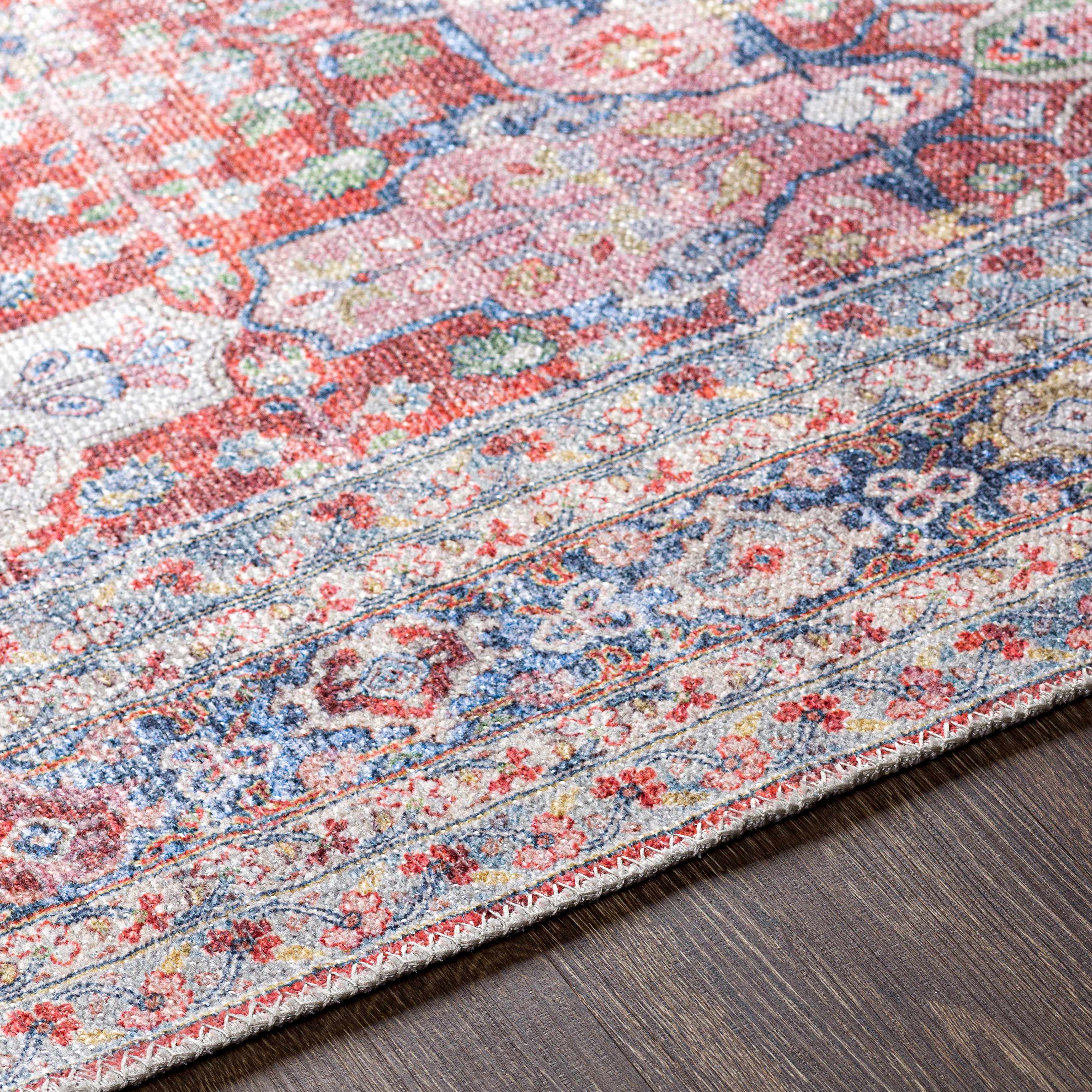 Close-up of the texture on Rust Goma Vintage  Area Rug - Clearance, showing fabric weave and feel. Traditional Area Rug Backing  